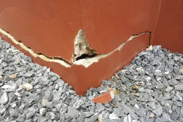 Cracked building foundation caused by poor soil conditions and lack of proper soil testing on a construction site in Denver.