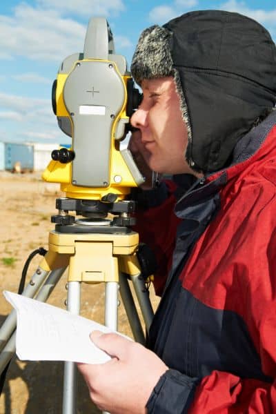 Alta survey table a items field verification - ALTA SURVEY Denver Land surveyor using a total station to verify site data for an ALTA survey after flooding and check Table A items