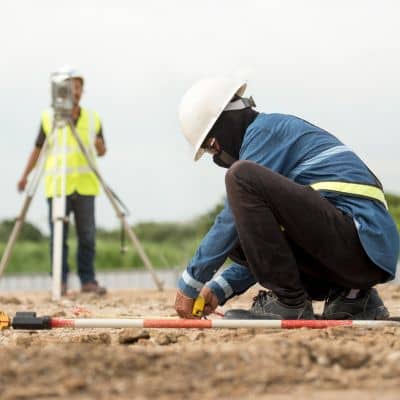 Construction site layout measurement - ALTA SURVEY Denver Construction layout measurement performed by a construction surveyor on an active job site