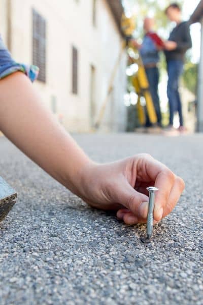 Surveyor marking a point on the ground during a land survey for fence planning