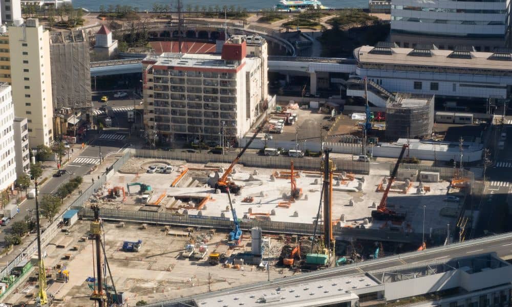 Urban construction site showing how a land development engineer plans infrastructure and site layout