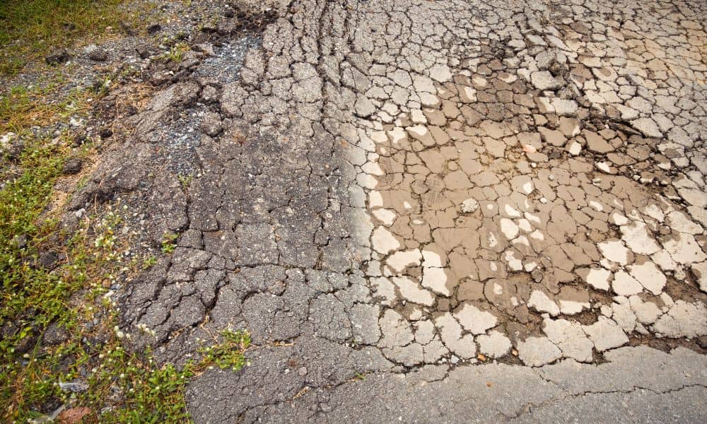 Cracked pavement showing damage caused by expansive soil and poor engineering design
