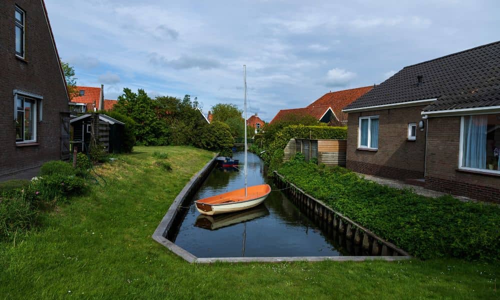 Home near canal residential area - ALTA SURVEY Denver Residential home near a canal showing flood risk where an elevation certificate may be needed