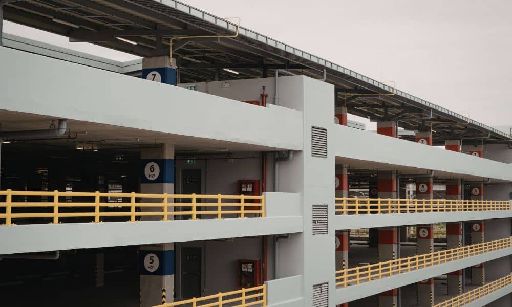 A multi-level parking garage showing ramps, columns, and structure, highlighting how urban engineering ensures safety and efficient design